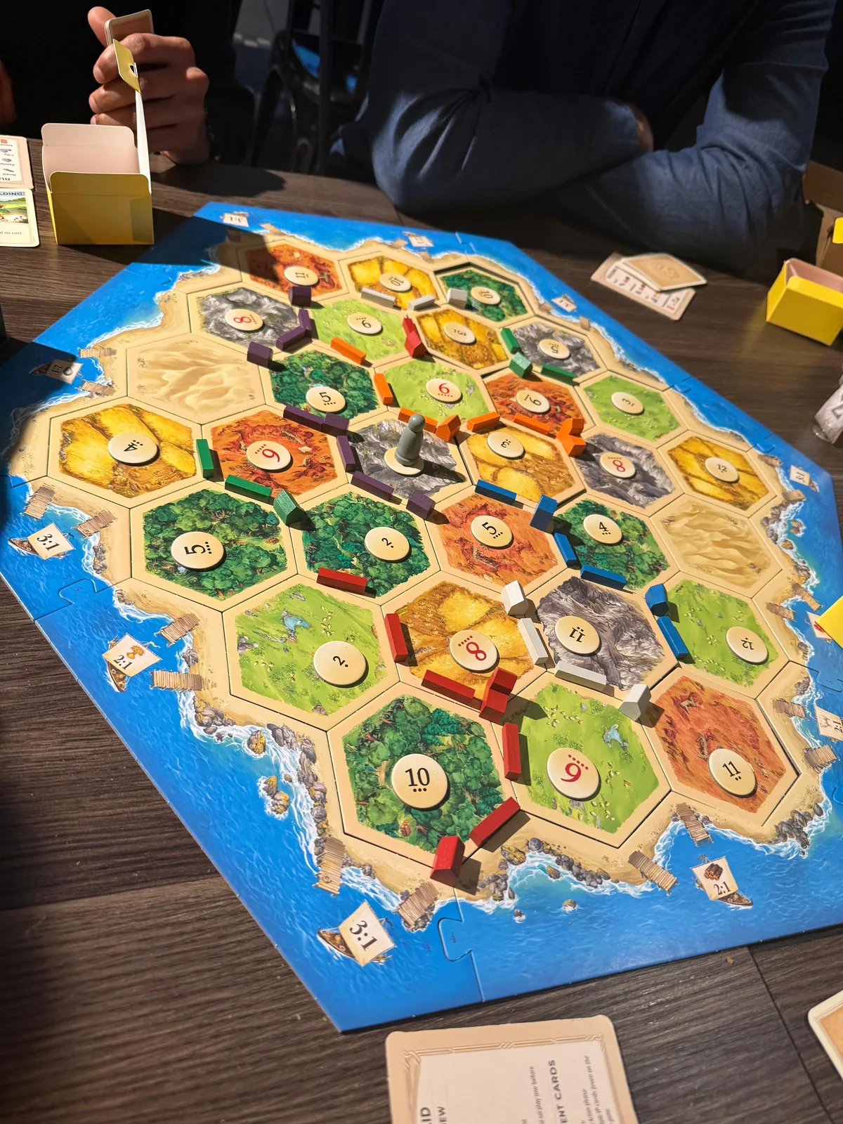 Settlers of Catan board in play with settlements and roads